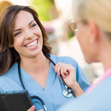 Doctor wearing stethoscope around neck smiling