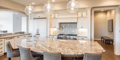 Beautiful kitchen remodel with shaker style cabinets and large granite island.