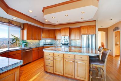 Bright kitchen with wooden cabinets and island.