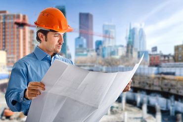 A foreman looking at a plan