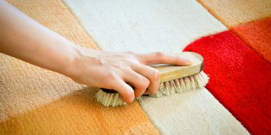 Premium Photo  Woman hand cleaning stain on carpet with hard brush. close  up of orange carpet wet cleaning. carpet cleaning service concept