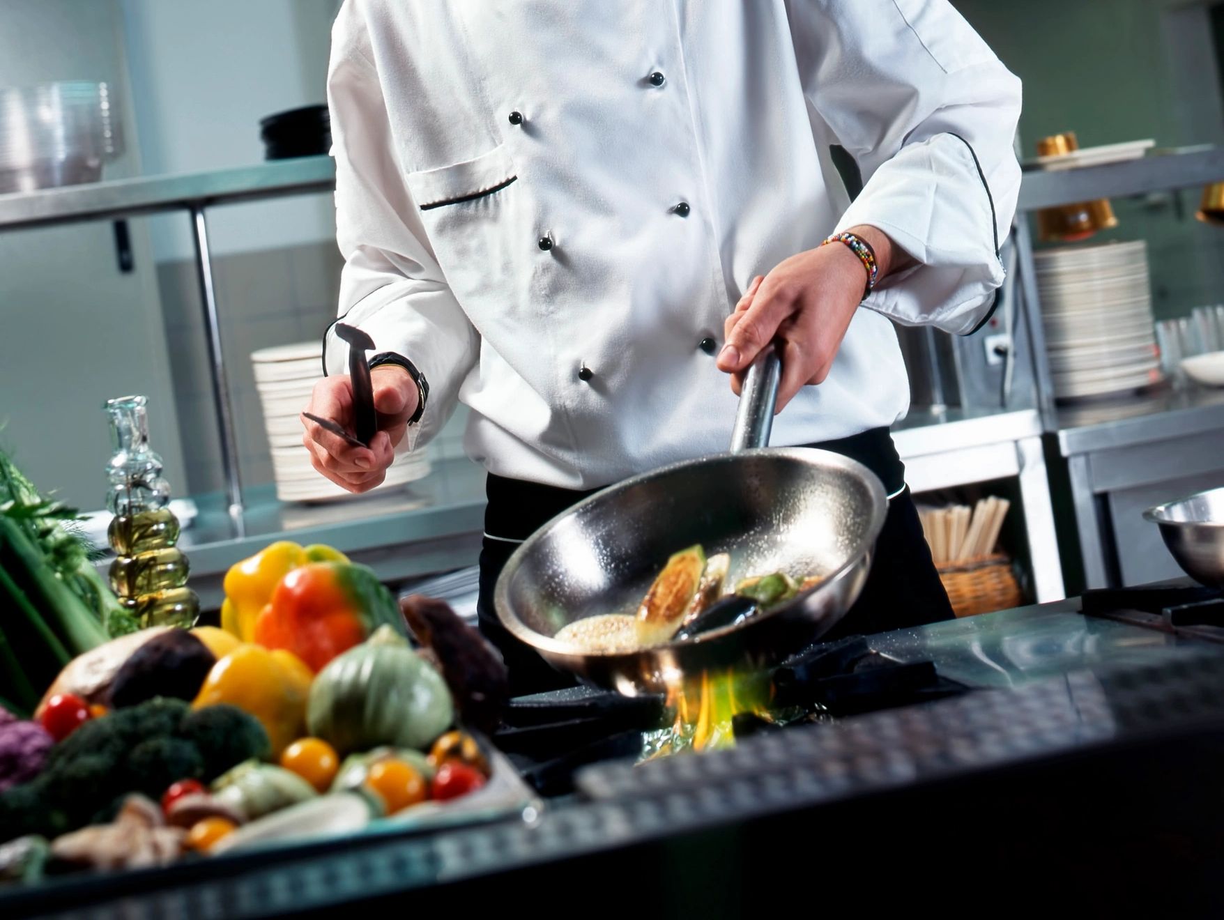 A Chef cooking in a professional commissary Kitchen. 