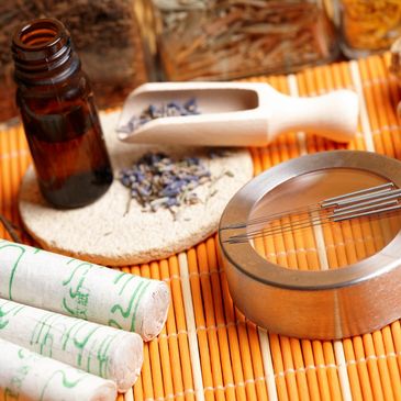 Acupuncture needles, moxibustion, and herbs in an acupuncture clinic
