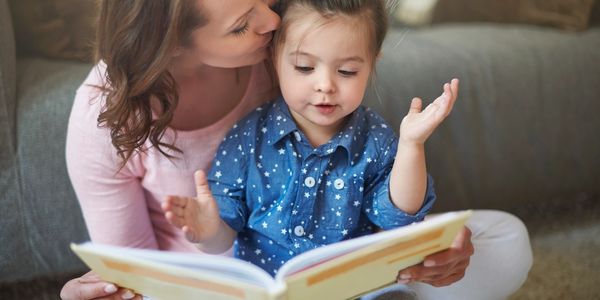 reading books with young children and using sign language to help support their language development