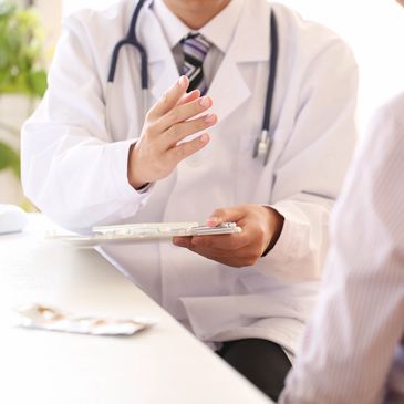 Doctor having a conversation with a patient.