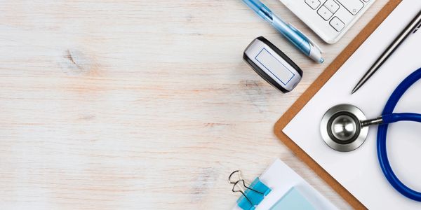 Photo of a desk with various desk accessories on it