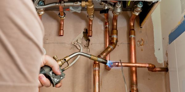 a man checking the pipes