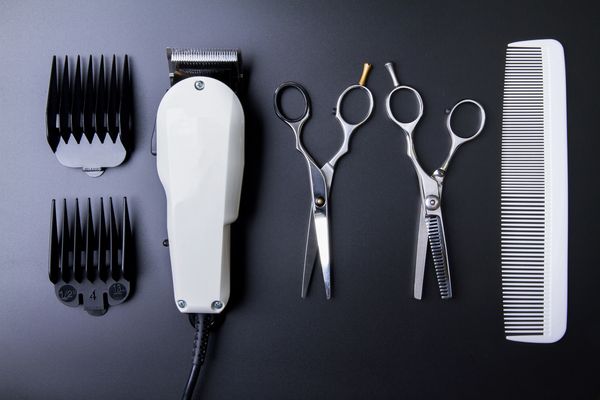 Clippers, scissors and comb used for haircuts at Empire Barber & Beauty Salon in Spring, TX.