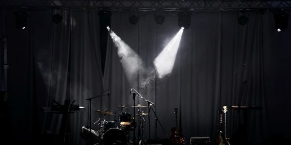 Empty stage with instruments and spotlights.