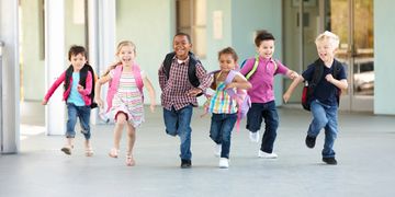 Kids running into the day care center