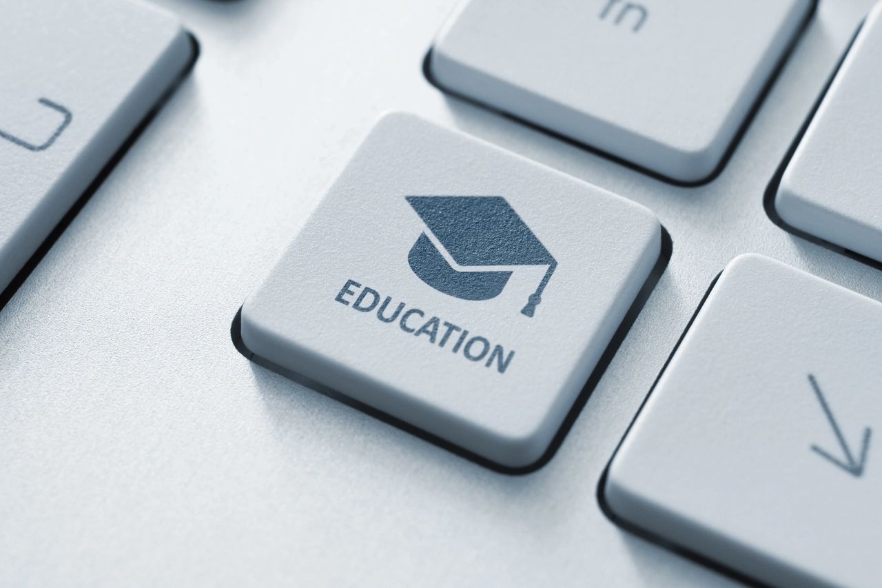 A keyboard with one key that says "EDUCATION" in all capital letters and a graduation cap icon.