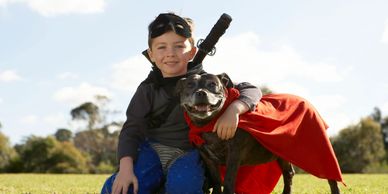 boy and his dog playing outside 