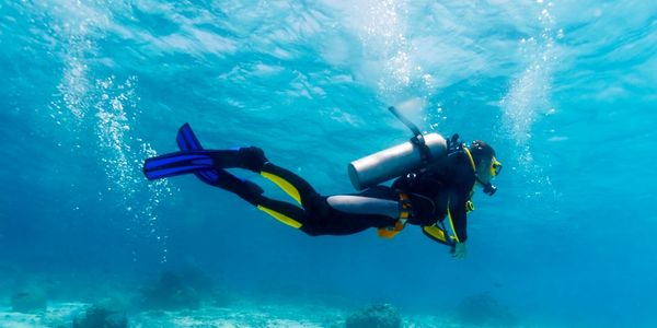 A single scuba diver swimming underwater