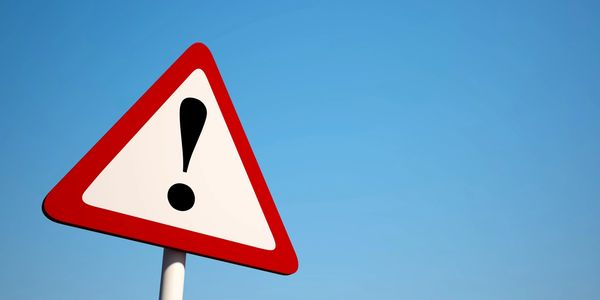 Warning sign with an exclamation mark.