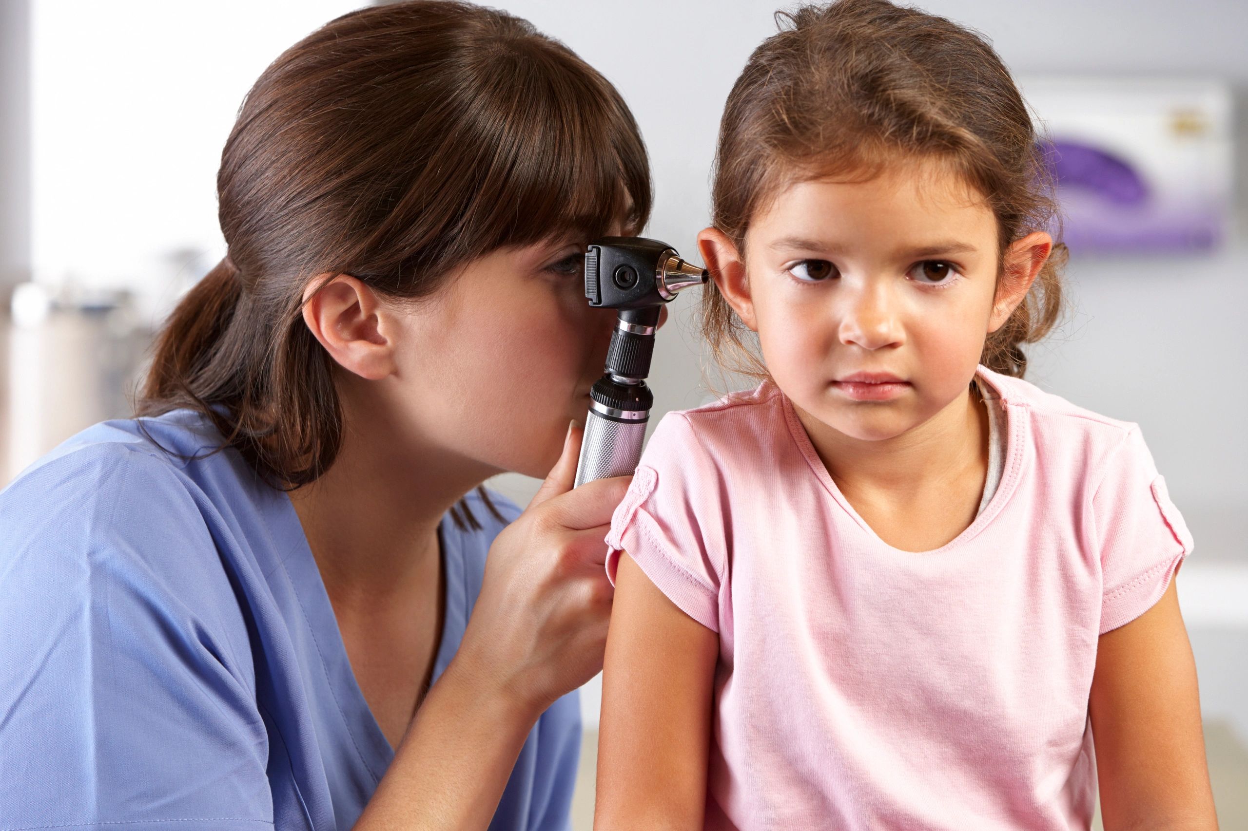 doctor checking kid ear
