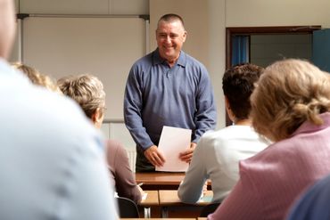 A teacher and students in a classroom.