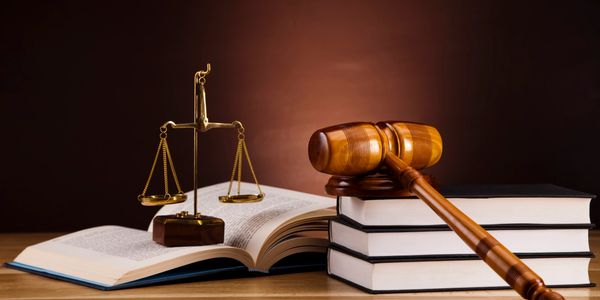 Legal books, scales of justice, and a gavel