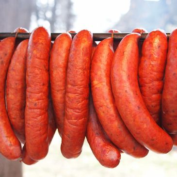 Sausages Pilled as a Line on a Metal Rod