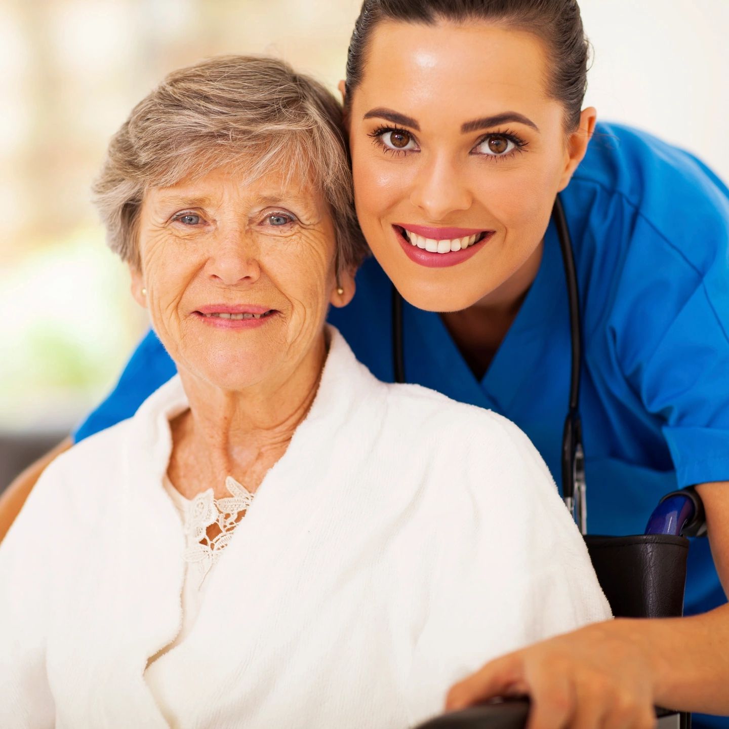 a specialist helping an elderly woman.