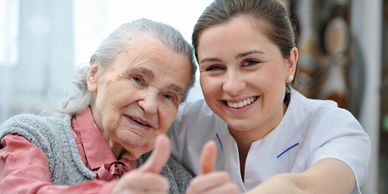 Caregiver supporting elderly patient with hygiene and daily routines