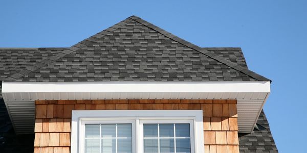 The home displays dark grey shingles on the home.