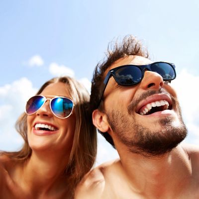 Happy smiling tanned couple