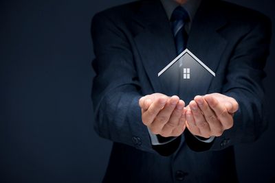 Man holding model house in hands