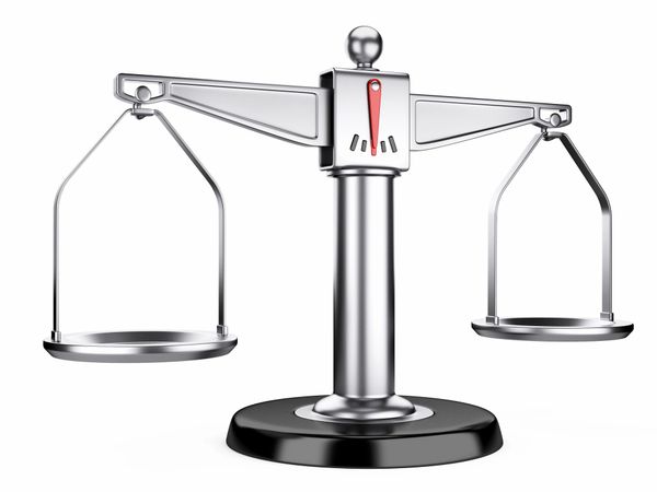 Close-up of a silver balance scale against a white background.