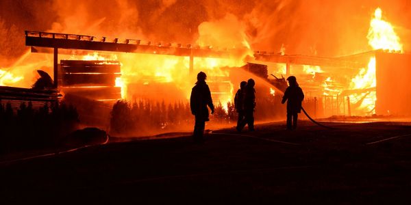 Picture of fire fighters watching a fire.