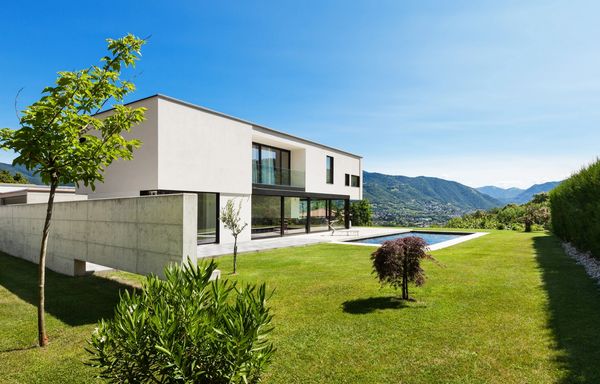 Contemporary style architecture home with an outdoor swimming pool with views of the mountains.