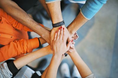 Group of employees hands together. 