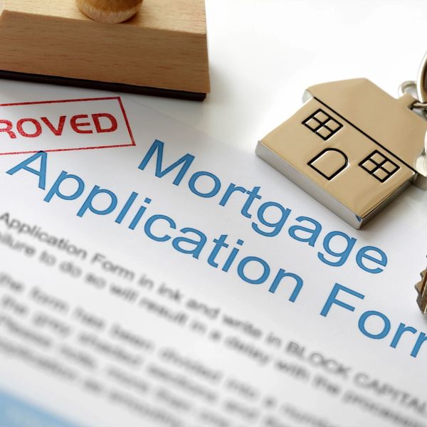 House Key Fob and Key and an approved mortgage application