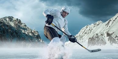 A man playing ice hockey On the mountain