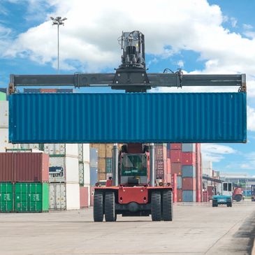 Container being lifted by forklift