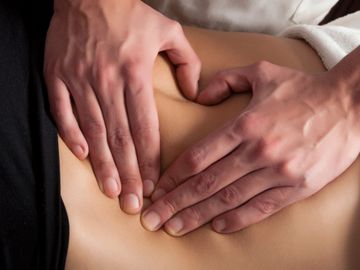 women receiving a post op manual lymphatic drainage massage