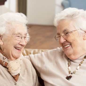 Two beautiful ladies enjoying some laughs and time together.