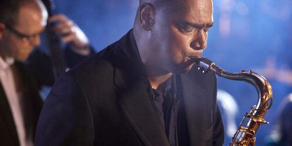 Musician playing a tenor saxophone. 