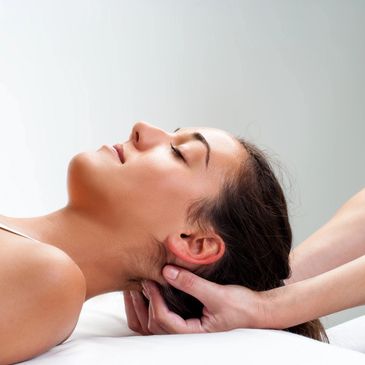 A woman getting neck massage done