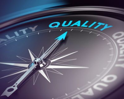 Compass pointing to the word quality