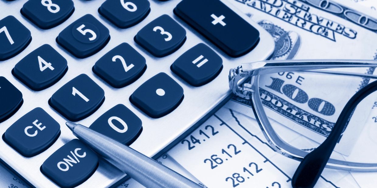 Calculator, money and pen all ready to figure out what it costs to revamp your kitchen in 2026.