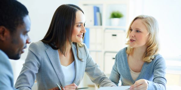 Financial business woman with her clients