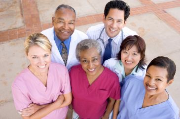Group of diverse healthcare professionals smiling.