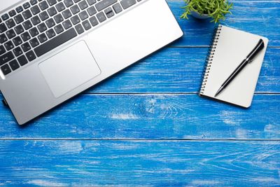 A computer keyboard and a pad of paper. Reminding you of our cancellation policy.