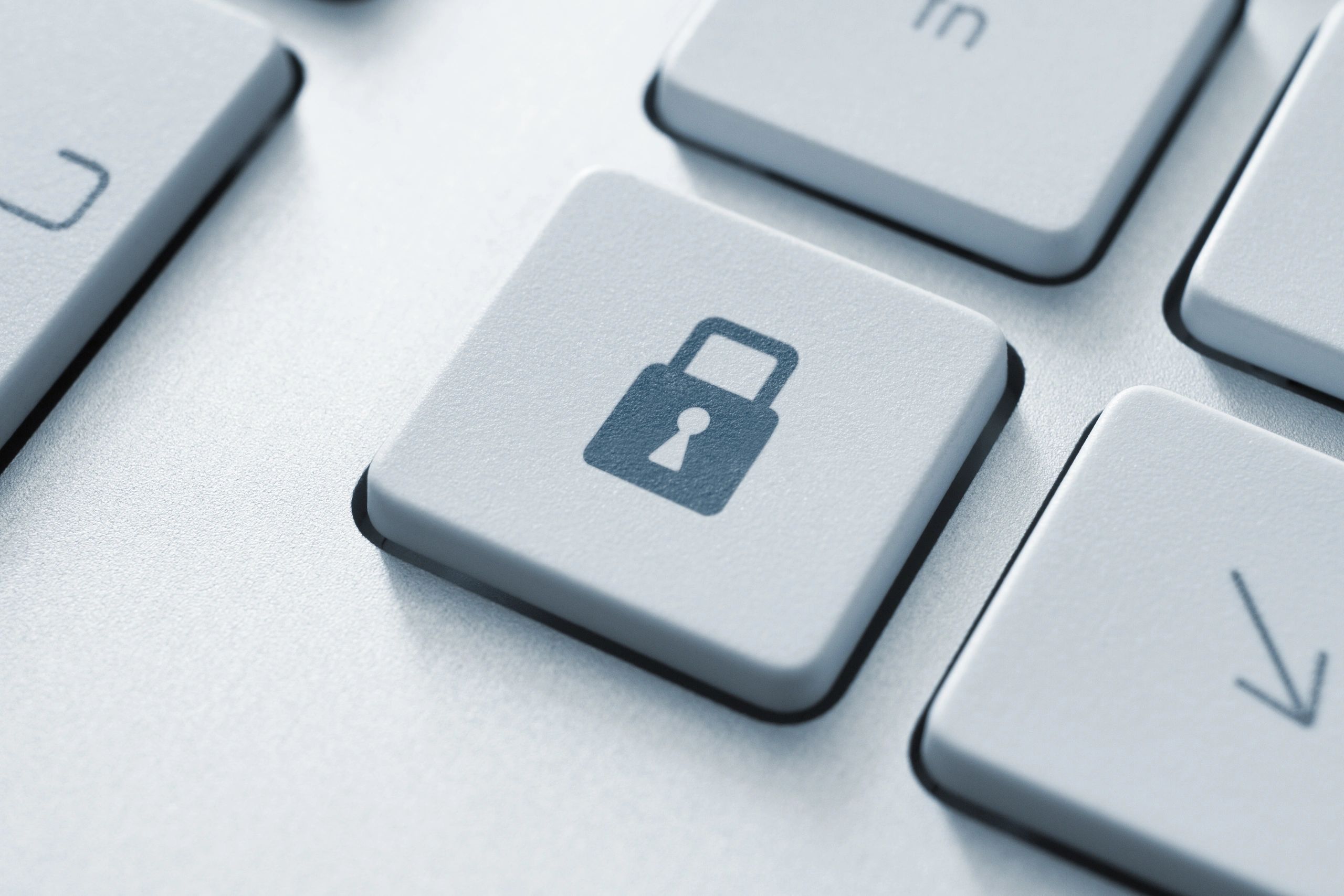 Close-up of a keyboard key with a lock symbol.