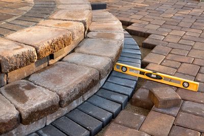 proper grading shows a level transition from pavers to steps. 