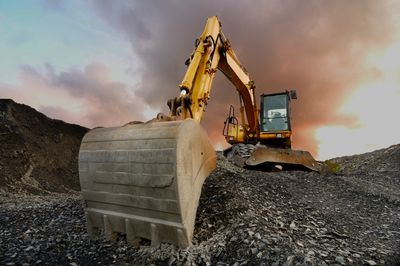 Excavator breaking ground on a new construction project in Halifax 