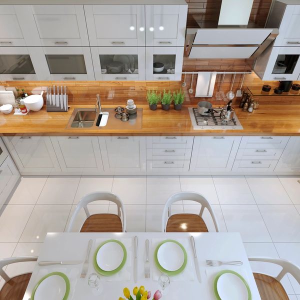 Kitchen With White Cabinets and Butcher Block Counters