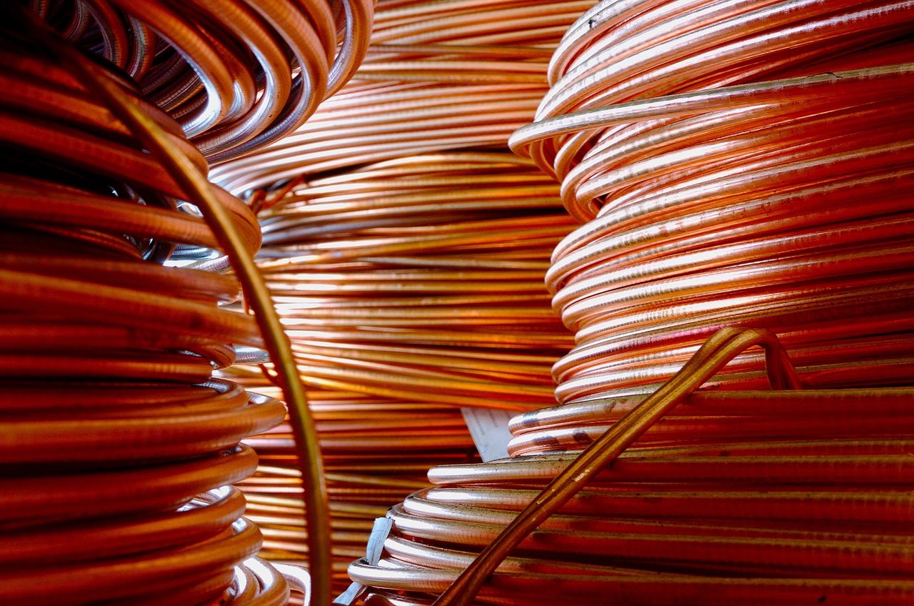 Three large coils of copper tubing consume the area.