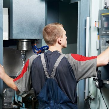Operator selecting tools in vertical machining center