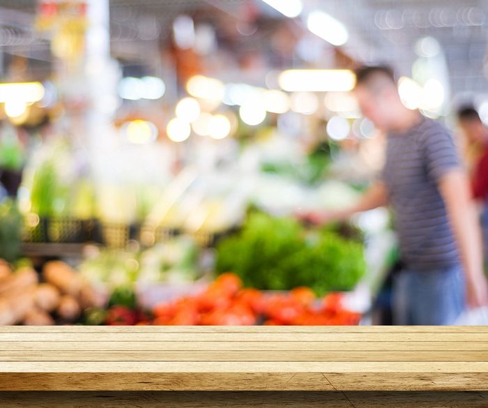 Grocery shopping in the produce section of the supermarket.